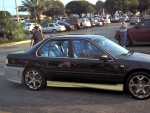 Bling effing BLING. Body kit in unmatched colors, blue window tint, Altezzas. YOU GET GUN