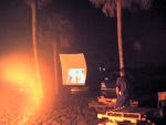Sure, the middle of the Everglades is not quite where you expect to be watching a movie... a shower curtain for a projection screen, a VGA projector (note bright spot to right of screen), and a laptop computer, and thusly... cheeeeeeese.