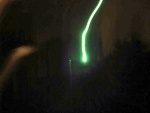 That effing light. It's 250 watts of pure mercury vapor PAIN. What's with the streak, you may ask? That's actually temporary burn-in on the camera's CCD... the actual exposure time was 1/250 sec, which was way too short to allow for motion blurring.