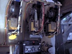 The steppers for counting minutes and seconds, of which there are four. I think each one has 10 steps, some of which are jumpered to fire the solenoid again and skip past them to make them function as divide-by-6 counters. The one with the leaf switch mounted on top is the 10-second counter; the leaf switch is activated by some tabs on the center hub, which trigger it every minute, to enable the roll-over to the minutes relay. The one at far right is the seconds relay, which basically has only two possible positions: 0 and 5. Exactly why they did not just use a flip-flop alternator relay there boggles the mind. These too are semicircular, and have a three-sided contact.