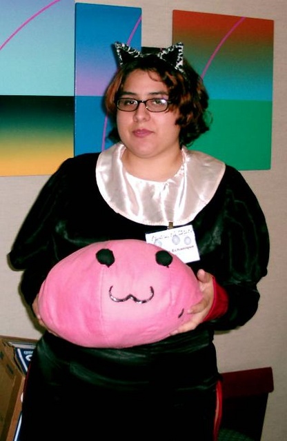 Deanna, comic goddess of redhalos.com, with her pet poring.