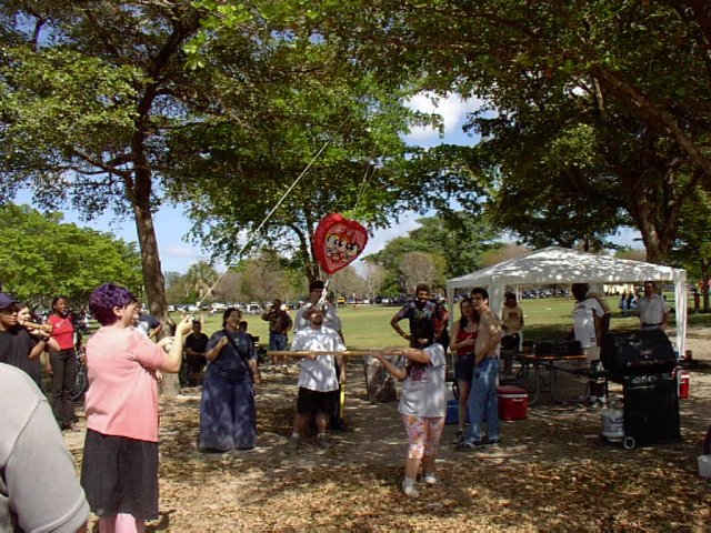 Kristal's sister takes a whack at the heathen pinata.