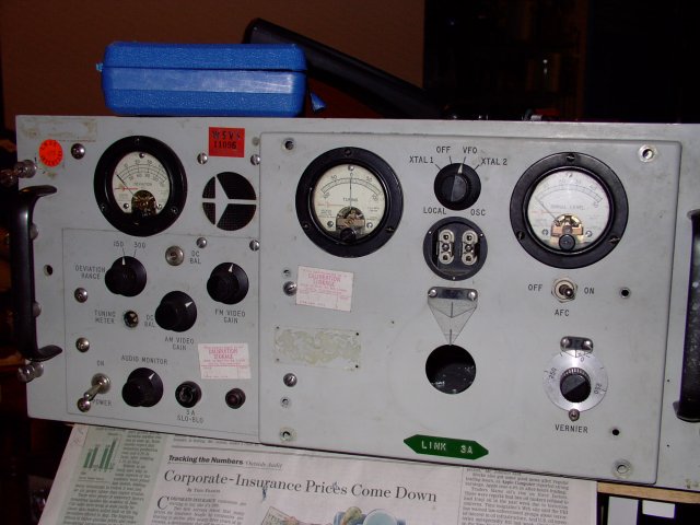 This was once a General Electronic Labratories (I think that was the brand?) satellite telemetry reciever... for sufficient values of 'telemetry' equal to 'television'. It contained about 45 vacuum tubes (if not more...), and I obtained it from a fellow geek under the condition that I give him back the tubes. No problem, as I had some great insane plans for it...