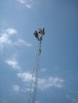 And there's the cap at the top to secure the upper guy wires! Chuck and Rich both go up and both become tiny.