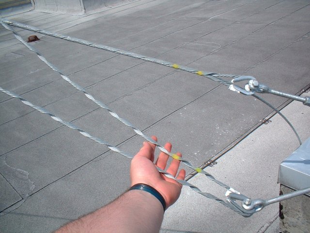 The neat preformed wire loops for the guy cables. These come as sort of an untwisted double helix thing. The inner surfaces are coated with an abrasive grit. When wound around the guy cable, they grip it like a Chinese fingertrap. The resulting fixture is supposedly stronger than the cable itself. This is much nicer than the nasty U-bolt clamp crap you find at Radio Shack... *g*