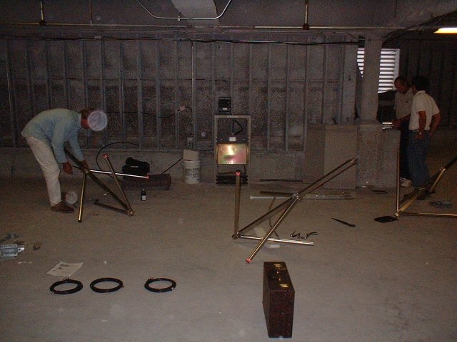 Getting ready for showtime! Roy Pressman, engineer, looks on as Rich from Breit's Tower Service assembles a bay of our Bext 3-bay antenna. The stainless steel bolts REALLY liked to freeze up on these things if not oiled.. one of 'em locked up on me after being merely finger-tightened. Yow.