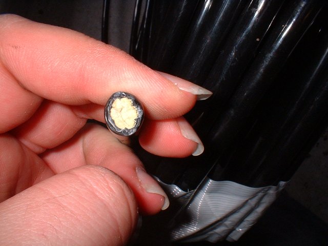 Here's the end. I think you're looking at Kevlar fiber here. It's stronger than steel,  but cuts with a knife. It's also $3.50 a foot or so. Welcome to the future. No, our cars do not fly yet.