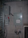 The repeater whose corner can be seen below, I believe, belongs to Miami-Dade Fire Rescue. The power transformer at upper left runs hot enough to fry eggs. Touching it is not advised.