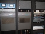WRGP transmitter setup. Left: SWR meter/alarm, coax switch remote, Harris Quest 500 transmitter. Center: Electro-Voice rackmount speaker, Harris Quest 500 transmitter (backup). Right: Speaker, Belar FMM-2 modulation meter, Belar frequency monitor, Orban Optimod-FM audio processor, Moseley STL reciever (currently not in use), rack blank, Berk remote unit (with Creepy Voice option!)