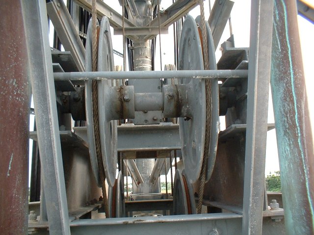 CREEPY elevator mechanism. You could not pay me enough to go up there. Aiee. See, that's why we've got tower crews...